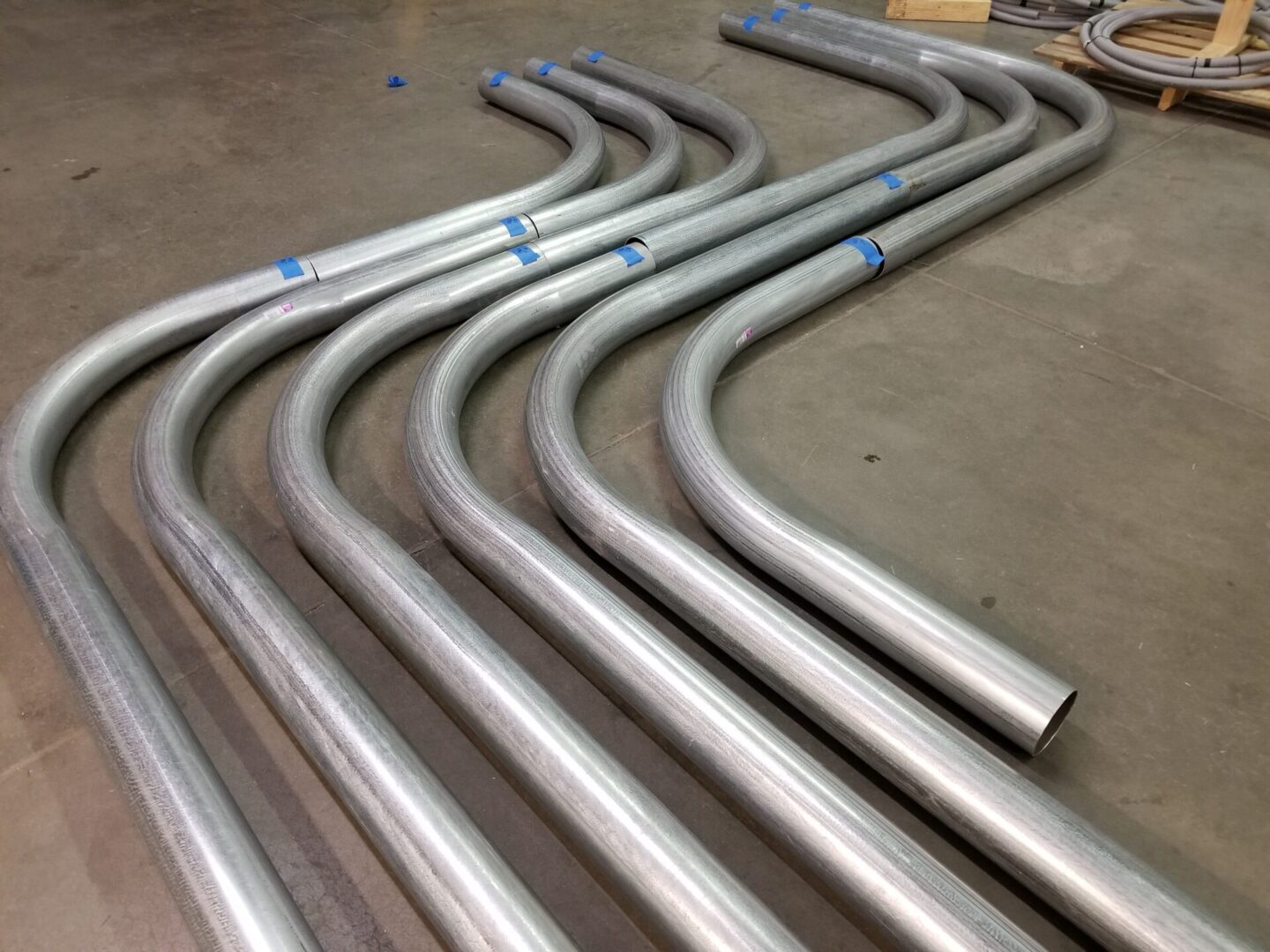 Curved metal pipes